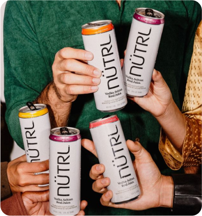 Group of people holding Nutrl cans